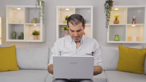 Concentrated-man-working-on-laptop.