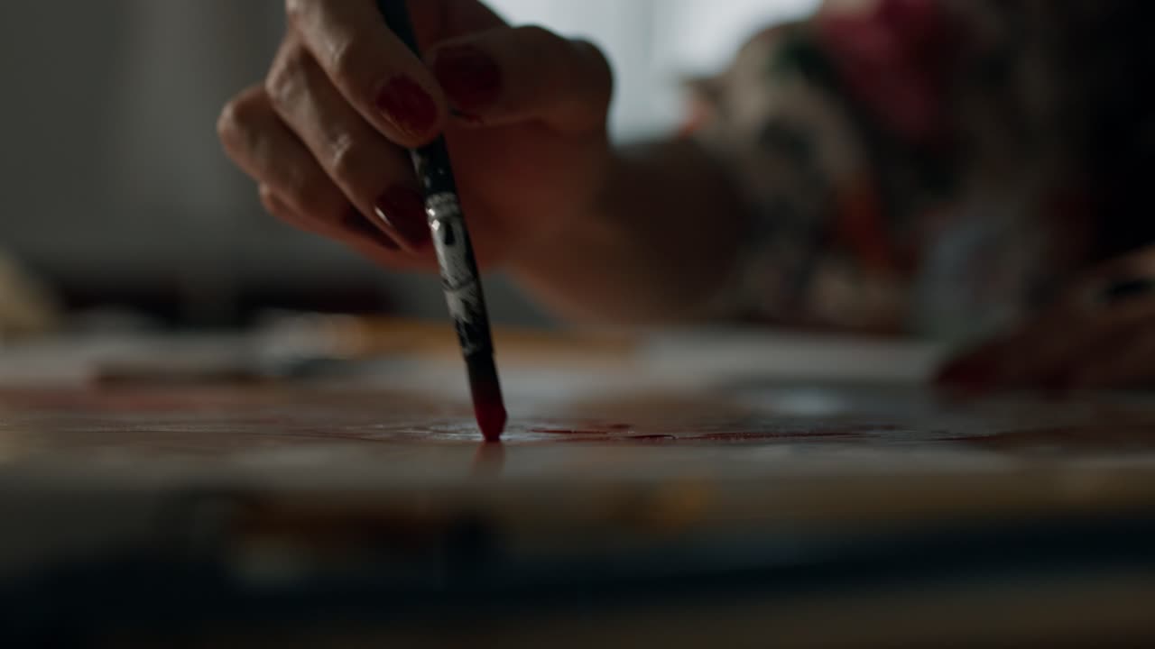 Close-up of a person painting with a paintbrush
