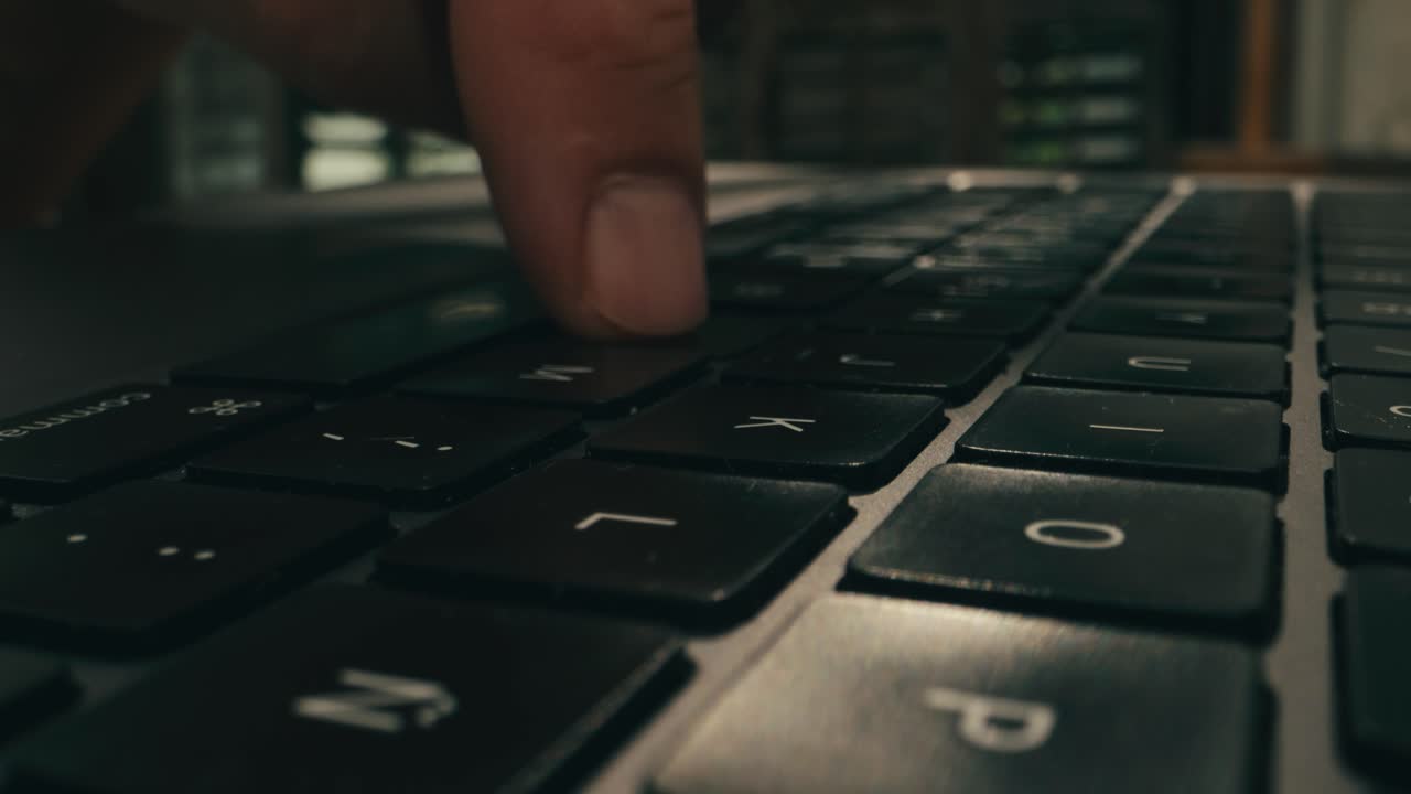 Closeup of hands typing on a laptop, showcasing productivity and advanced technology in a modern workspace