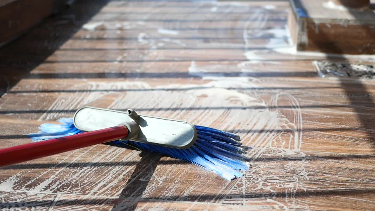 Cleaning a Tiled or Wooden Floor with Soap and Brush
