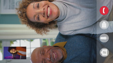 vertical video with device screen and icons as couple make video call to friend visiting london eye