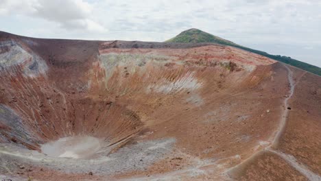 aerial view of volcano crater and sulfuric smokes on volcano island in sicily , italy tourism destinations