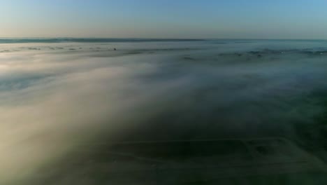beautiful footage of a landscape above the clouds