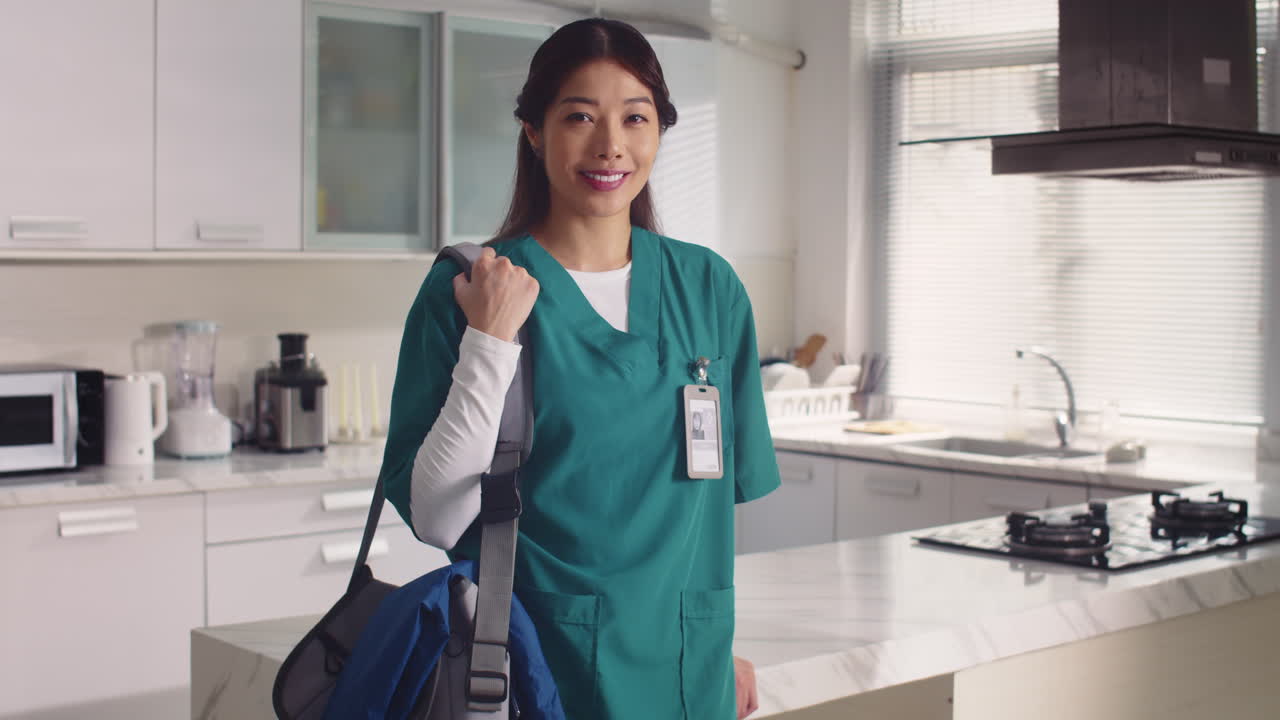 Vertical Portrait of Cheerful Asian Nurse in Medical Uniform