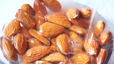 Pouring-water-ion-almond-nut