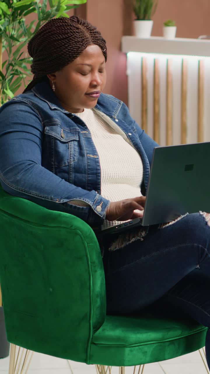 Vertical video Hotel guest working on webpage