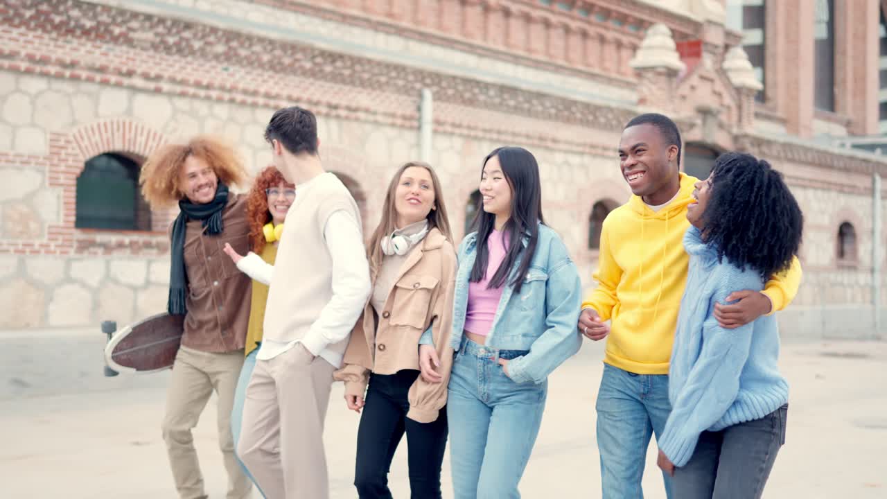 Multi-ethnic friends strolling together relaxed in the city