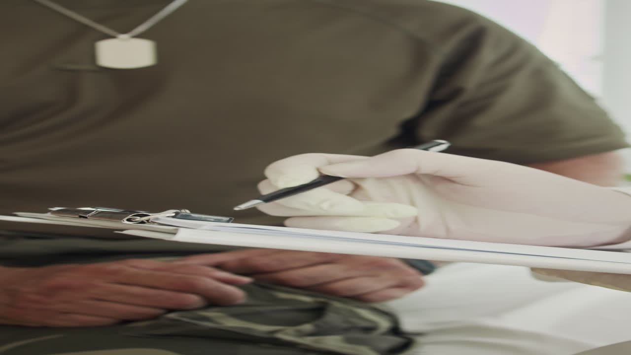 Clinician Signing Treatment Document and Supporting Ex-soldier
