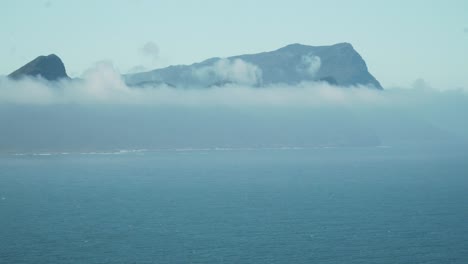 fog and mist on the mountain in cape town, south africa - wide shot