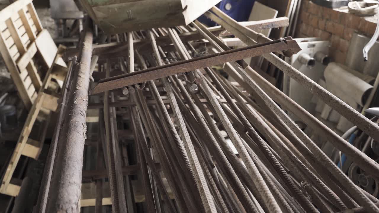 Old and rustic armature pieces and metal scrap in old warehouse