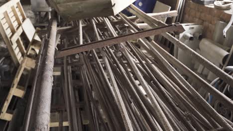 old and rustic armature pieces and metal scrap in old warehouse