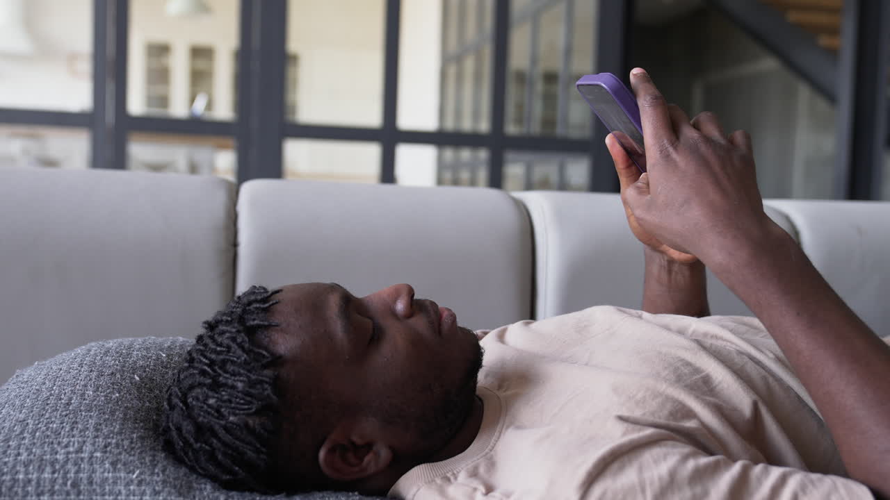 Man using phone at home