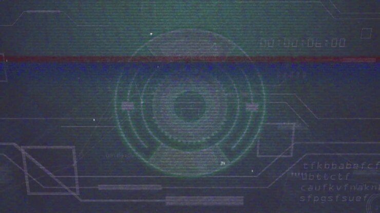 Startskærm viser cirkulær HUD, mens glitch opstår, og ringe roterer og viser status.