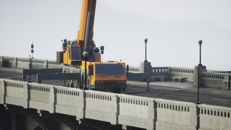 orange crane on a bridge