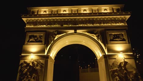 paris' arc de triomphe-inspired arch in the evening aerial drone flying up 4k