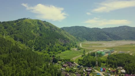 aerial flying over the tourist town in the area of the ancient mountains