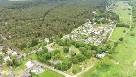 small lithuanian town with forest and river on sides, aerial view