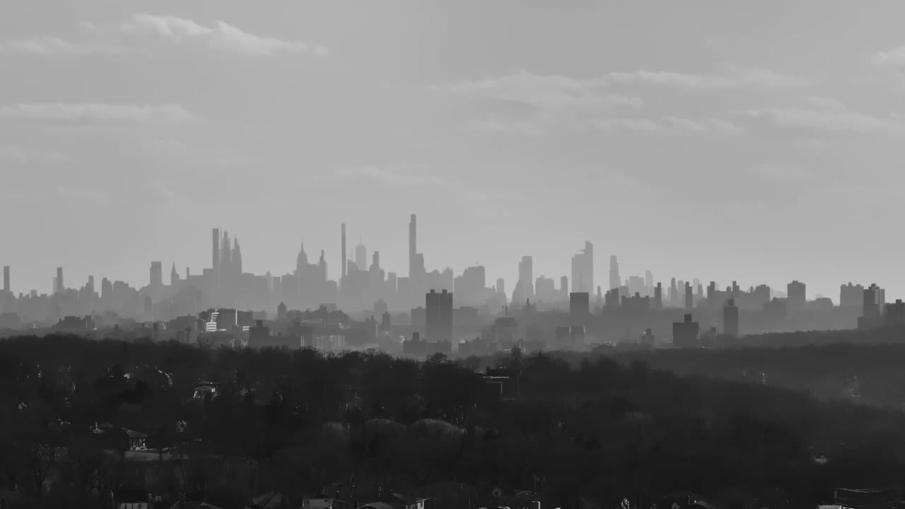 NYC skyline from 15 miles away on a zoom lens drone (black and white).