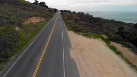 Aerial-of-Motorcyclist-Riding-on-California-Coast-Highway-One