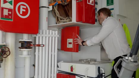 ship captain inspect the international shore connection for fire fighting