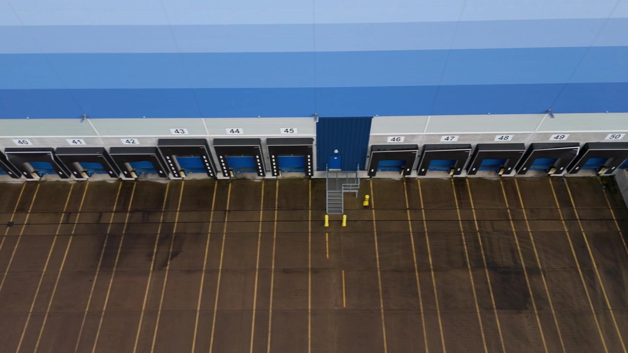 Aerial view of sprawling warehouse infrastructure and supply chain hubs in Leicestershire.