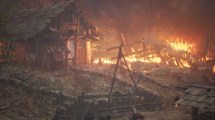 Burning wooden house in old village