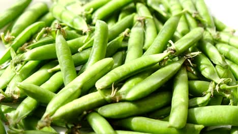 pea pods fresh greens rotating top view pea pods fresh greens rotating top view