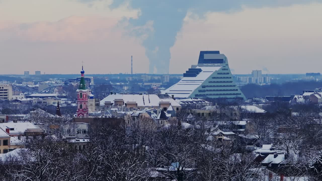 A cold winter day in Riga, where snowy rooftops contrast against urban landmarks