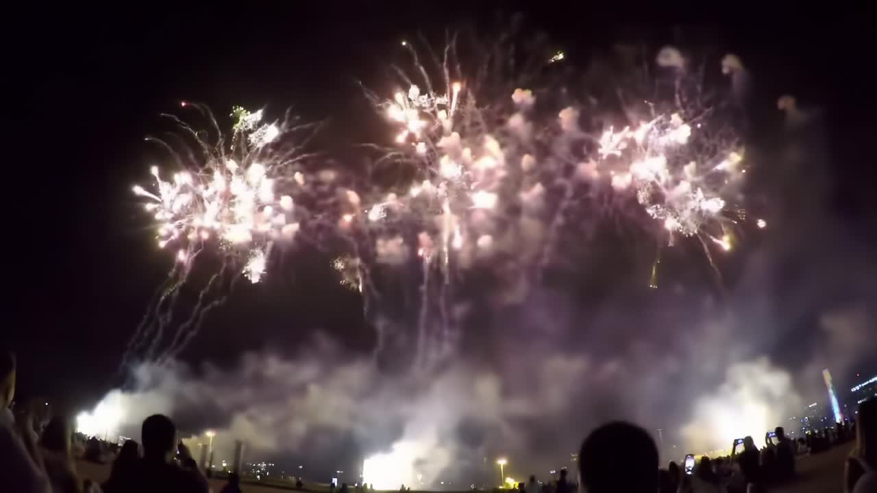 Spectacular Firework Display Lights up the Night Sky in a Coastal City Celebration