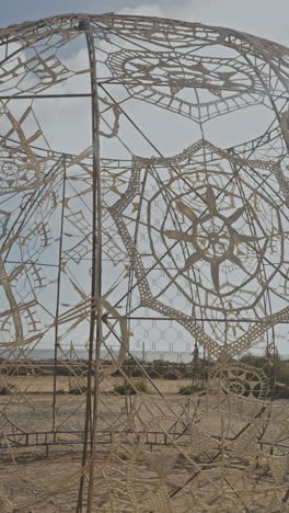 woven art pattern by the beach in barcelona in vertical