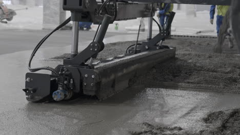 pouring concrete floor with machine