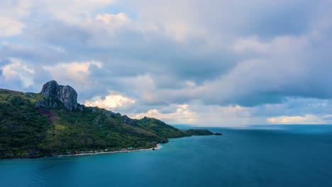 timelapse of rain clouds approaching a paradise island in the pacific ocean, 4k