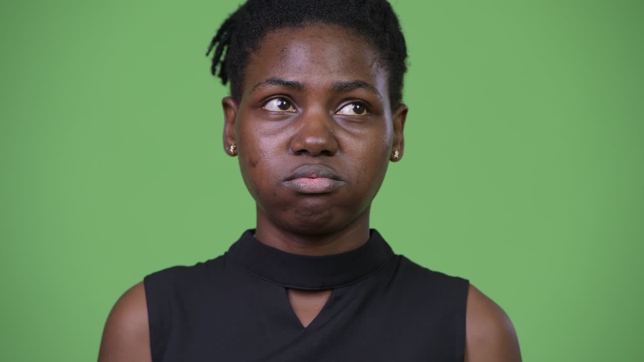 Young beautiful African businesswoman looking bored