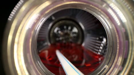 starting near the opening, pulling out of sport drink or juice bottle
