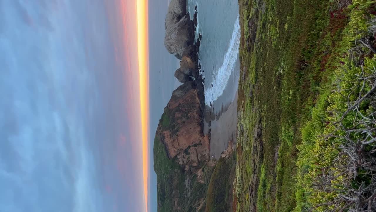 Incredible view of the sunset with orange colors on the coast.