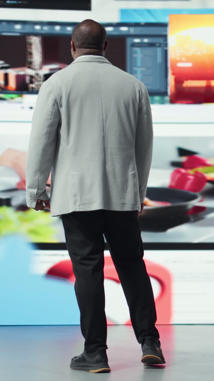 Vertical video User embraces video content on digital wall dashboard