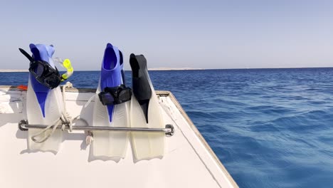 scuba fins or flippers on diving boat in the sea