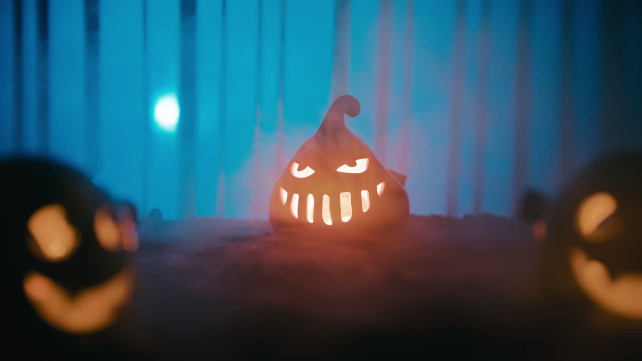 Flashing Halloween pumpkin in front of blue background