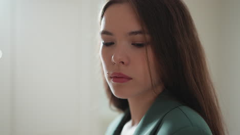 woman in a green jacket