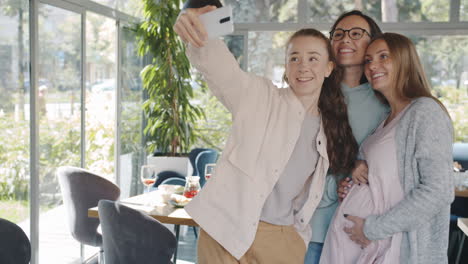 Friends Taking a Selfie in a Cafe
