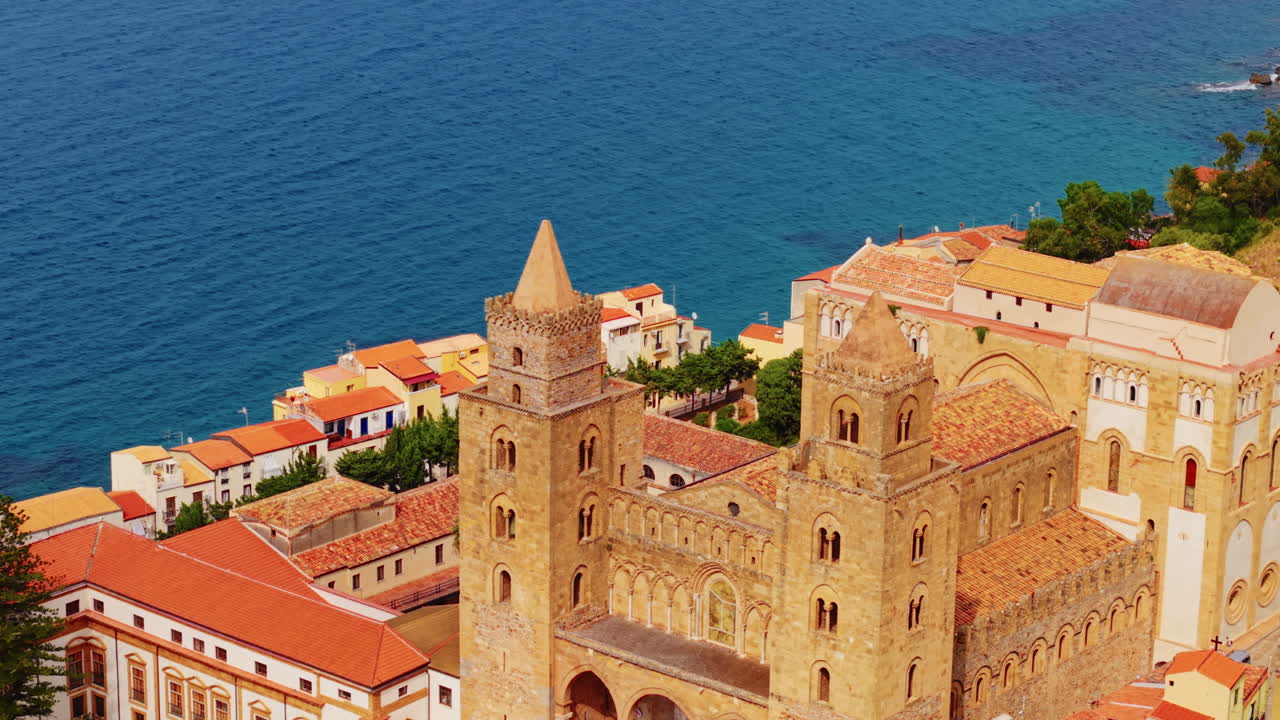 Cefalù cathedral by sea, captures historic charm and coastal beauty