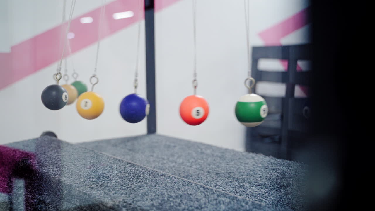 Newton's cradle showing laws of physics in motion. Museum of Science