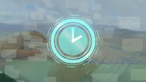 animación de reloj girando, manos de empresario escribiendo y iconos de correo sobre el paisaje verde