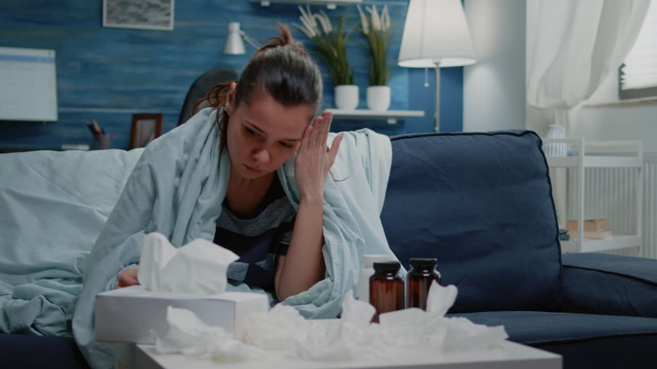 Person reading labels of capsule tablets and bottle with pills
