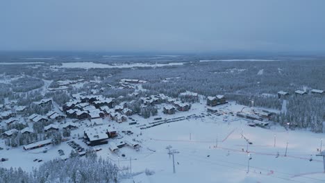 panoramic view of levi town, ski resort and winter spruce forest