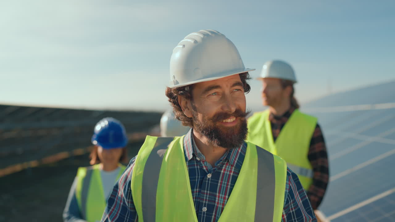 Engineers working on a solar panel farm