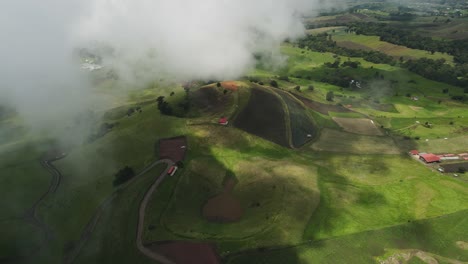 Aerial-Drone-Flyover-Green-Mountain-Countryside-With-Volcanic-Lagoon,-Costa-Rica-4K