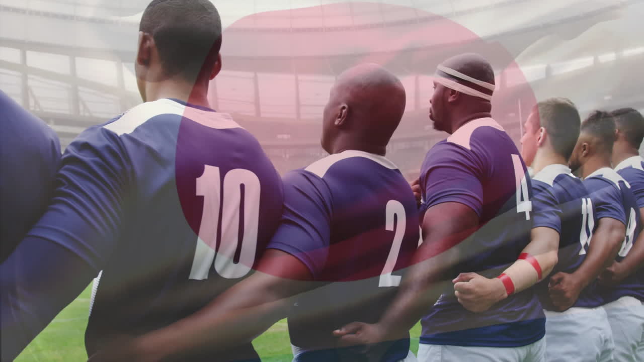 Animation of flag of japan over diverse rugby players on field