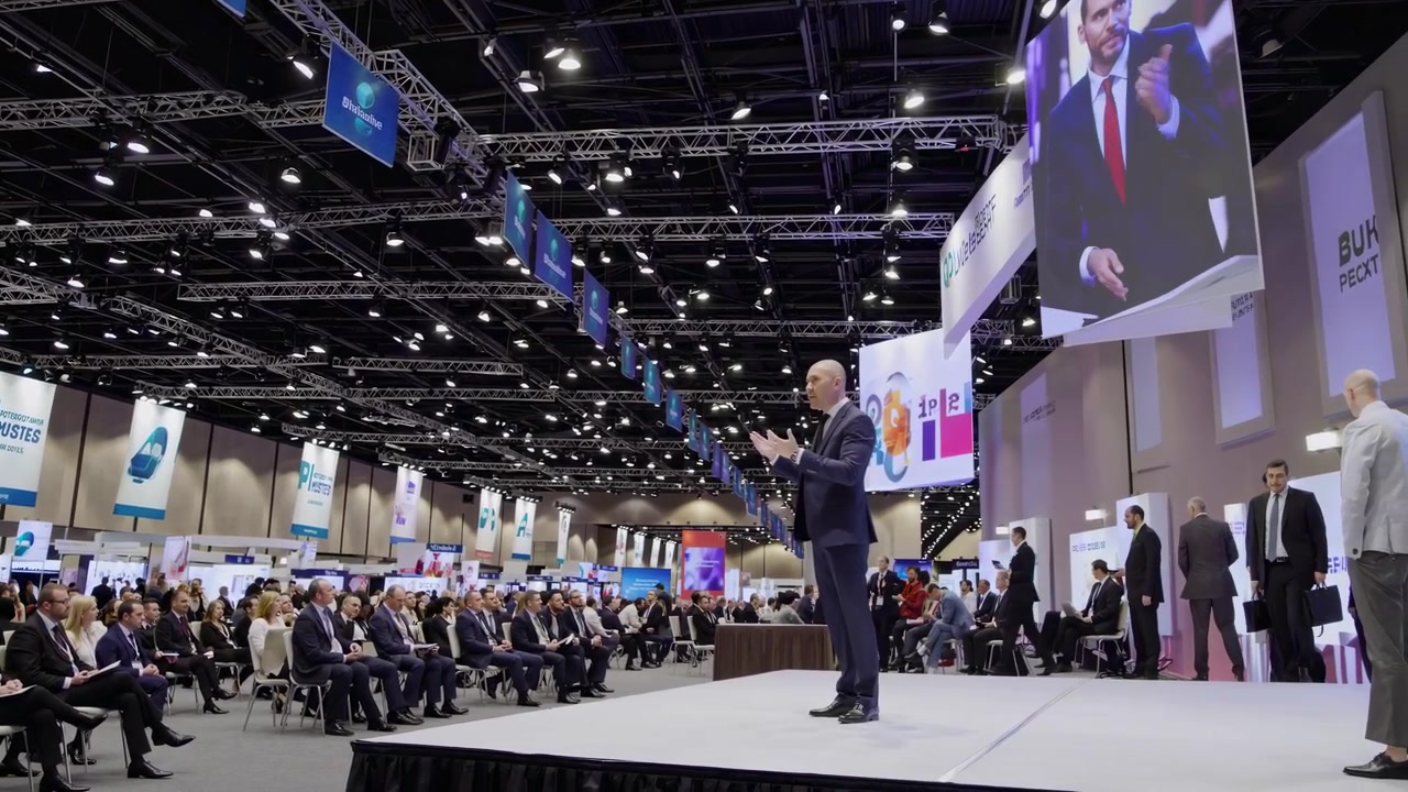 Speaker Presenting at a Large Corporate Business Conference