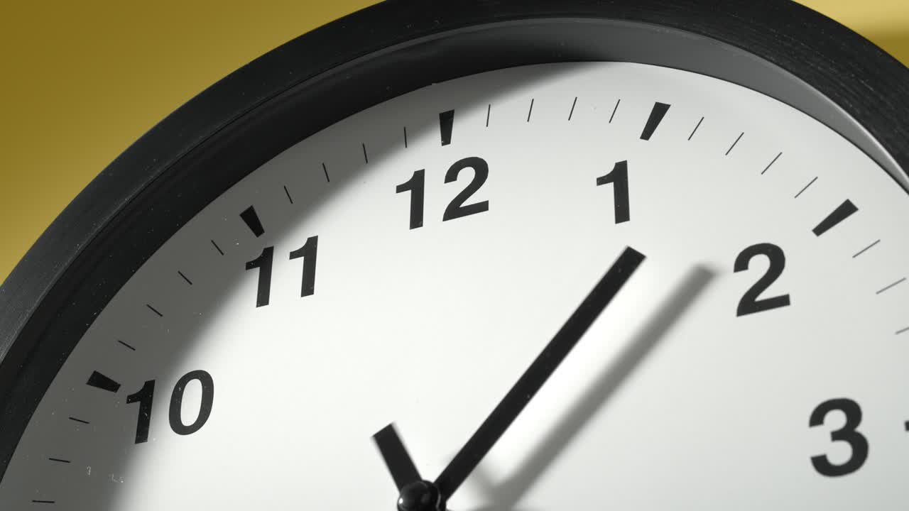 Clock Face on Yellow Wall in Time Lapse